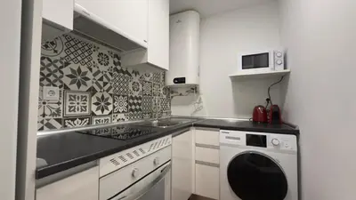 Una cocina o zona de cocina en Central and Cozy in Madrid 3D