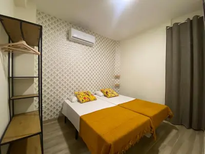 Cama o camas de una habitación en El Jardín de Usera