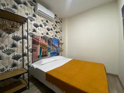 Cama o camas de una habitación en El Jardín de Usera