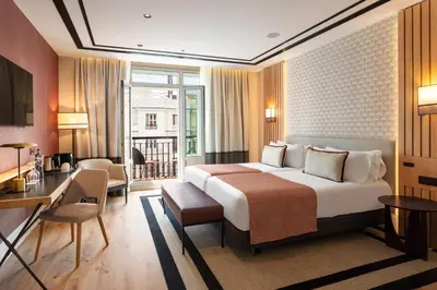 Cama o camas de una habitación en Catalonia Plaza España Hotel & Spa