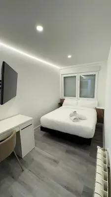 Cama o camas de una habitación en JACUZZI ROOMS PUENTE De VALLECAS
