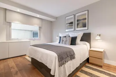 Cama o camas de una habitación en Stylish 1BR Apartment with City Views – Colón