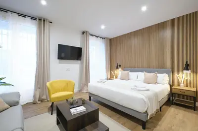 Cama o camas de una habitación en Lovely Apartments - Loft de lujo en la mejor ubicación de Madrid