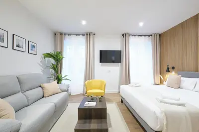 Cama o camas de una habitación en Lovely Apartments - Loft de lujo en la mejor ubicación de Madrid