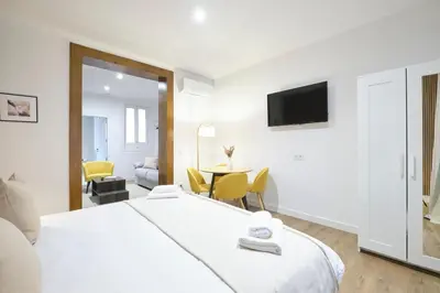 Cama o camas de una habitación en Lovely Apartments - Elegante apartamento en el corazón de la ciudad