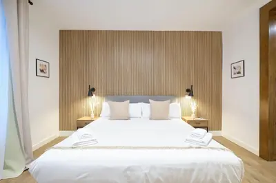 Cama o camas de una habitación en Lovely Apartments - Elegante apartamento en el corazón de la ciudad