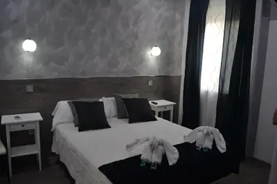 Cama o camas de una habitación en Hostal Meyra