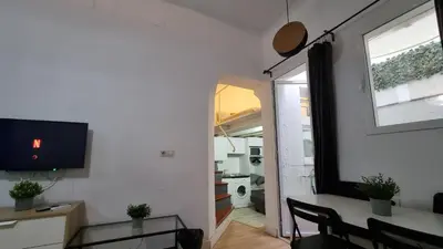 Una televisión o centro de entretenimiento en Apartamento MADRID CENTRO MALASAÑA