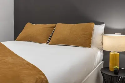 Cama o camas de una habitación en Queen's Las Letras Boutique I - Alojamiento Corta Estancia