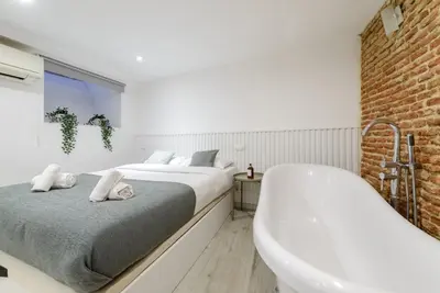Cama o camas de una habitación en GuestReady - Lovely home in the Chueca area