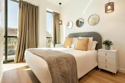 Cama o camas de una habitación en Catalina en Madrid