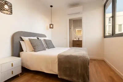 Cama o camas de una habitación en Catalina en Madrid