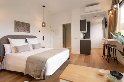 Cama o camas de una habitación en Catalina en Madrid