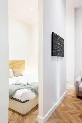 Cama o camas de una habitación en 4- Hotel-style apartment in Puerta del Sol