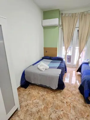 Cama o camas de una habitación en Apartamentos EconoStay Sol