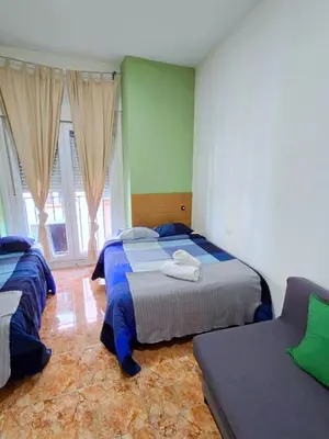 Cama o camas de una habitación en Apartamentos EconoStay Sol