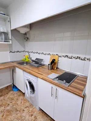 Una cocina o zona de cocina en Apartamentos EconoStay Sol