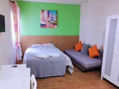 Cama o camas de una habitación en Apartamentos EconoStay Sol
