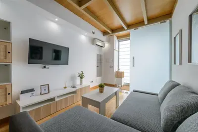 Una televisión o centro de entretenimiento en GuestReady - Tempting stay in Madrid
