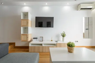 Una televisión o centro de entretenimiento en GuestReady - Tempting stay in Madrid