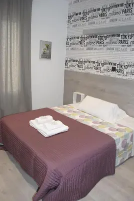 Cama o camas de una habitación en Fuencarral Rooms