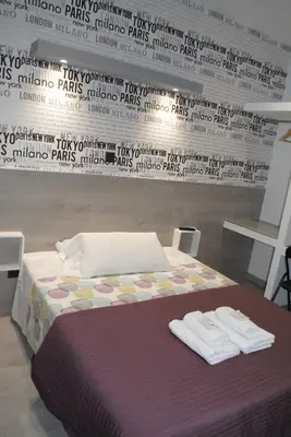 Cama o camas de una habitación en Fuencarral Rooms