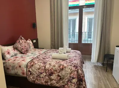 Cama o camas de una habitación en Hostal Corazón de Madrid 2
