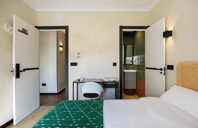 Cama o camas de una habitación en The Raimundo