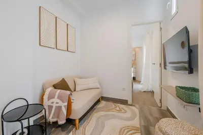 Una televisión o centro de entretenimiento en Cute & Cozy apartment in Retiro