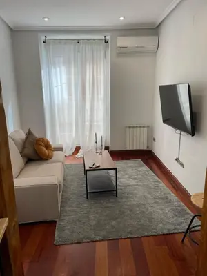Una televisión o centro de entretenimiento en Exyca Homes Gran Vía