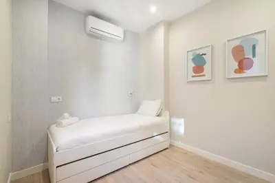 Cama o camas de una habitación en Modern, brand-new apartment for 4 in Las Letras - Huertas
