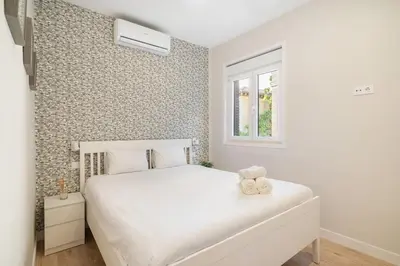Cama o camas de una habitación en Modern, brand-new apartment for 4 in Las Letras - Huertas