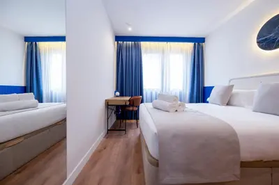 Cama o camas de una habitación en Iconic Suites