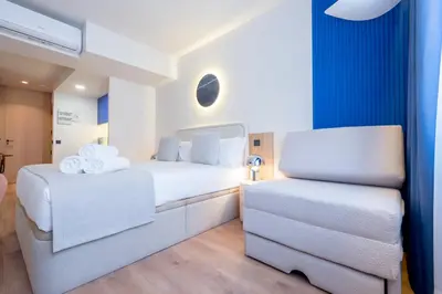 Cama o camas de una habitación en Iconic Suites
