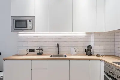 Una cocina o zona de cocina en Acogedor Apartamento en Azca QA
