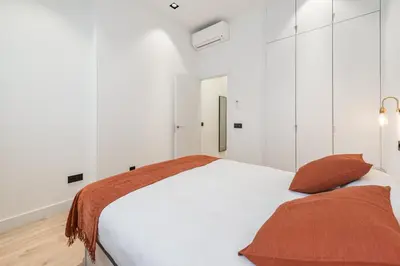 Cama o camas de una habitación en Acogedor Apartamento en Azca QA