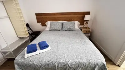 Cama o camas de una habitación en Apartamentos corazón de Chamberí