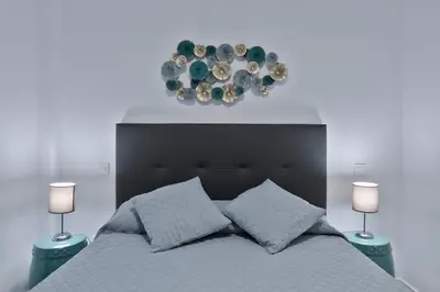 Cama o camas de una habitación en Alcam Madrid Palencia