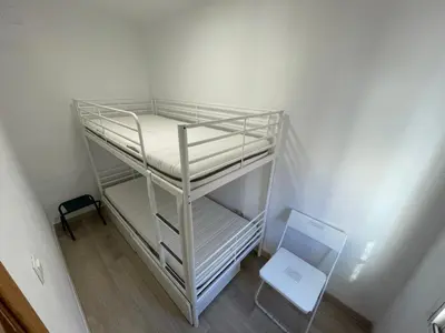 Cama o camas de una habitación en Piso en calle Álvarez de la Ribera 18