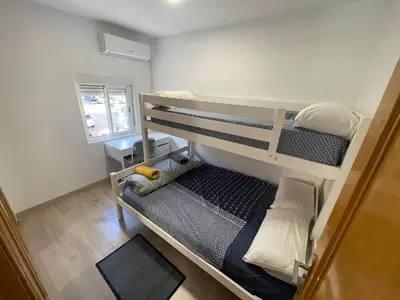 Cama o camas de una habitación en Piso en calle Álvarez de la Ribera 18