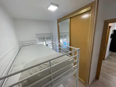 Cama o camas de una habitación en Piso en calle Álvarez de la Ribera 18