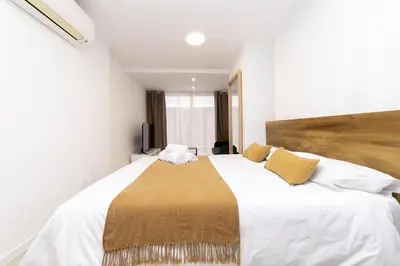 Cama o camas de una habitación en Regency VII - Ferga Suites