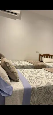 Cama o camas de una habitación en Hostal Conchita