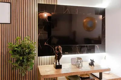 Una televisión o centro de entretenimiento en Luxury central apartment