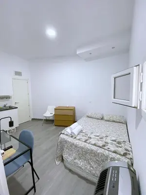 Cama o camas de una habitación en Apartamentos TravelStay Fuencarral