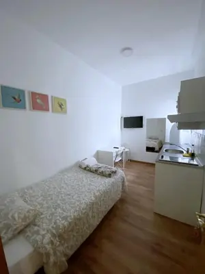 Cama o camas de una habitación en Apartamentos TravelStay Fuencarral