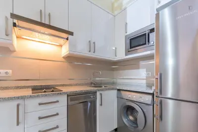 Una cocina o zona de cocina en Apartamentos Puzzle Madrid Sol