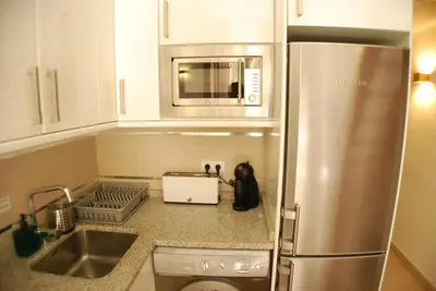Una cocina o zona de cocina en Apartamentos Puzzle Madrid Sol