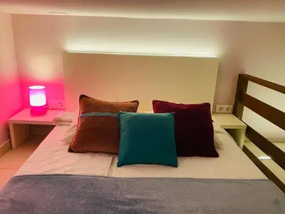 Cama o camas de una habitación en Apartamentos Puzzle Madrid Sol