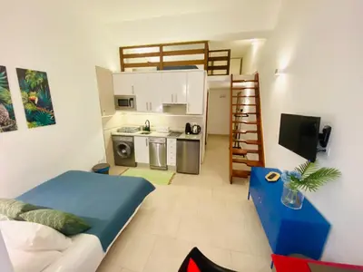 Una cocina o zona de cocina en Apartamentos Puzzle Madrid Sol